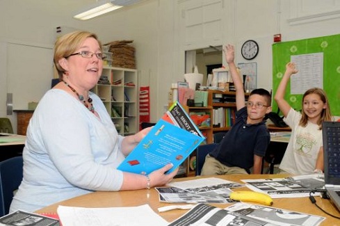 Source: Houston Chronicle, Principal Beth Bonnette poses question to students eager to answer